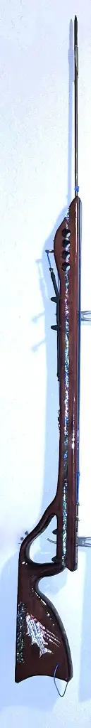 Topgun Speargun Exotic Wood Padauk inlay down the stock on one side and a hog snapper and a grass bed and on the other side - a great white in abalone inlay.webp